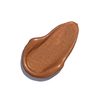 Shimmering bronze cream swatch, perfect for highlighting and adding a glow to your makeup routine.